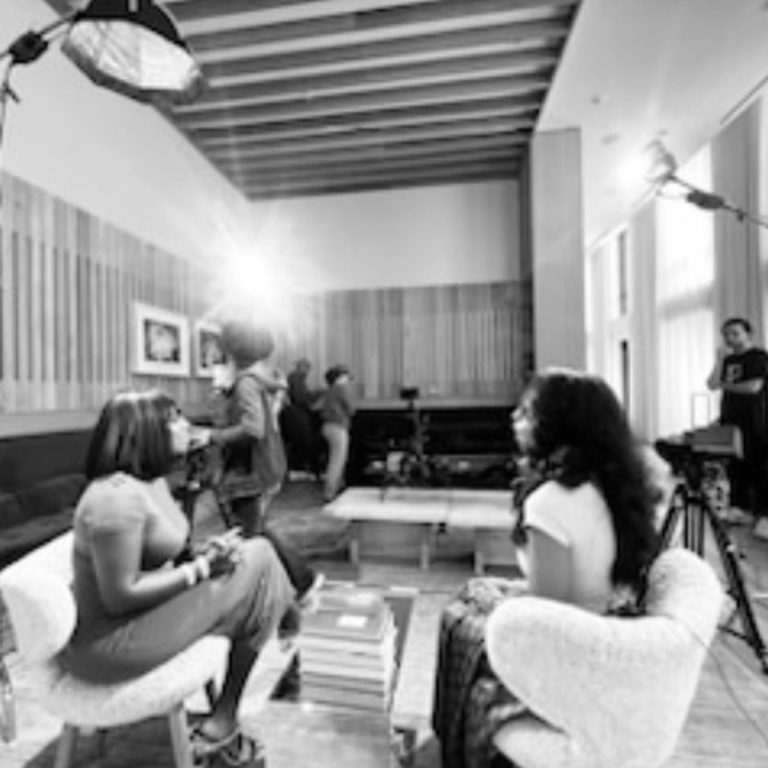 A conversation being filmed in a production space